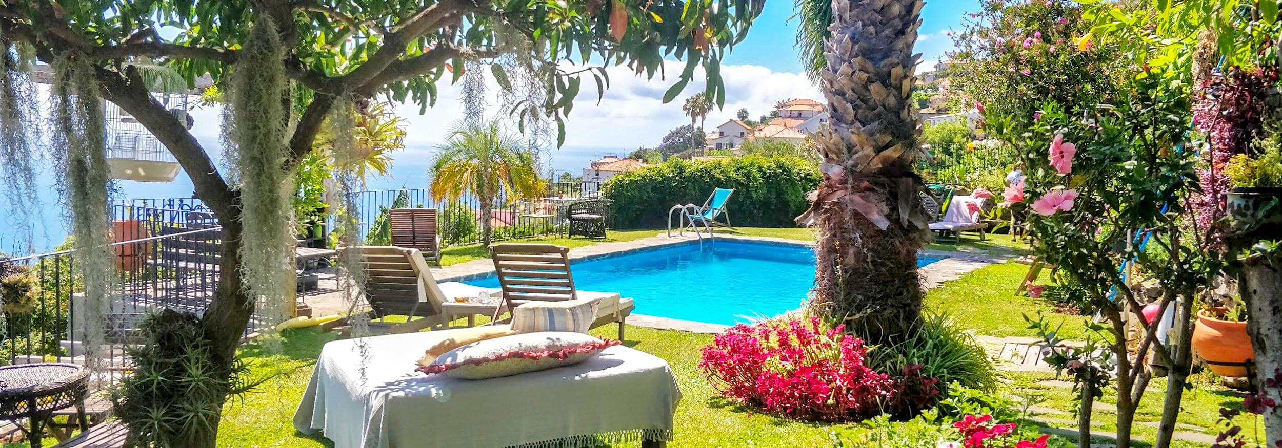 Calhau Grande’s gardens and pool above the Atlantic Ocean